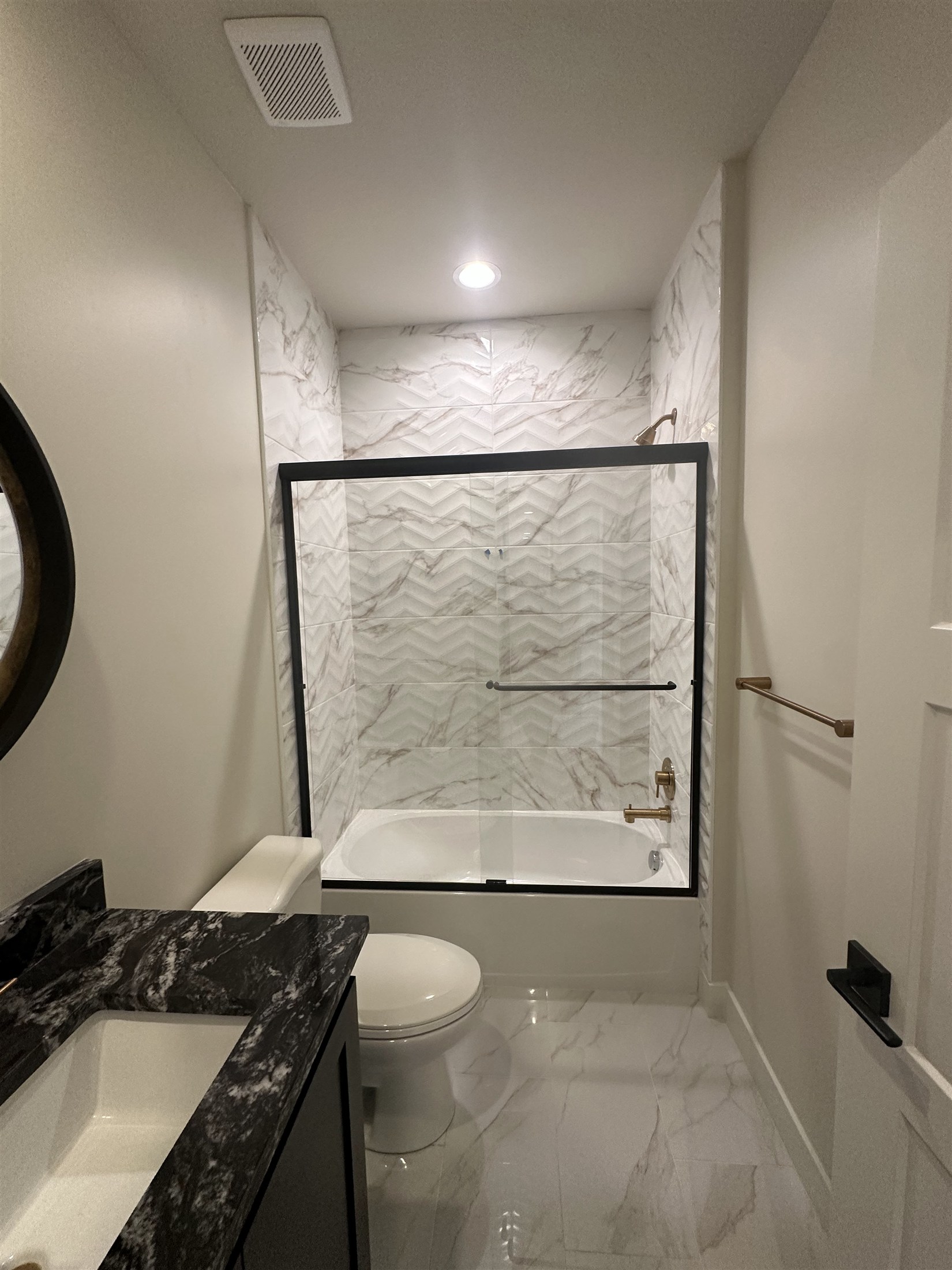 Glass shower & tile bathroom installed by Heartland Tile